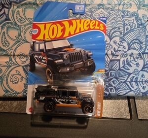 2025 Super Treasure Hunt - Hot Wheels Black and Orange Off-Road Jeep With Symbol